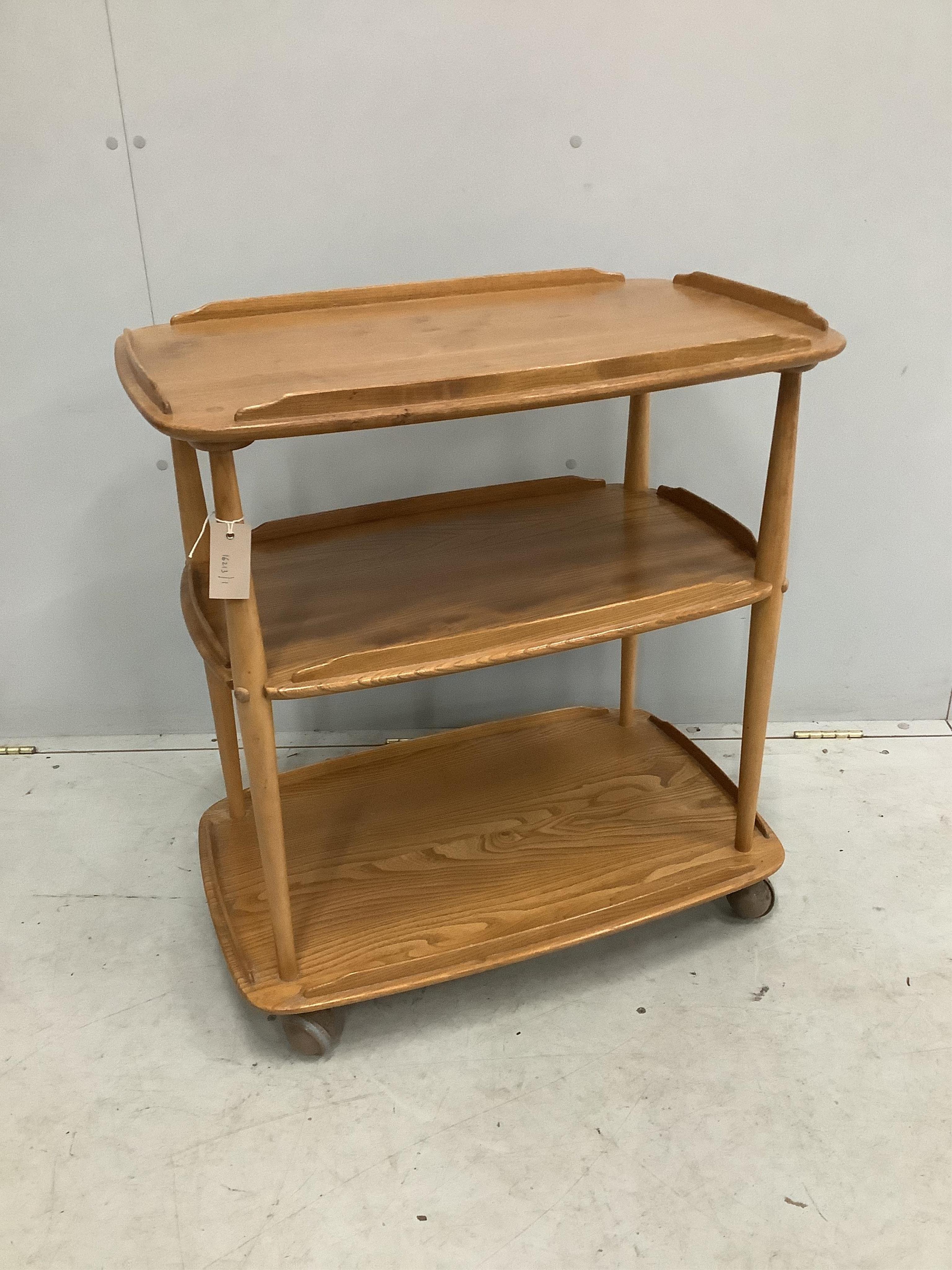 An Ercol Windsor elm three tier trolley, width 71cm, depth 46cm, height 76cm. Condition - fair, top ring-marked